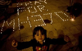 A Malaysian child during a vigil for missing Malaysia Airlines passengers in Kuala Lumpur.