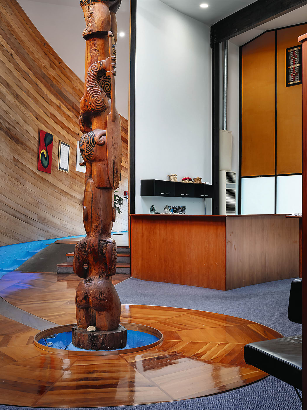 Puukenga's central gathering space with a pouihi carved by Blaine Te Rito.