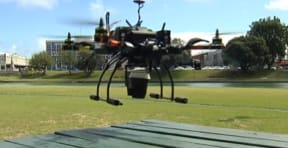 Picture of Dave Dunlop's drone dropping off a coffee on a picnic table for TV3 a year ago.