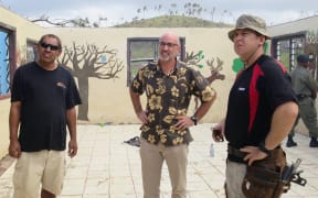 NZ High Commissioner, Mark Ramsden, surveys damage.  (Centre).