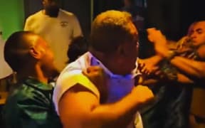 Sevuloni Naucukidi, centre, can be seen throwing punches as bar staff try to contain him.