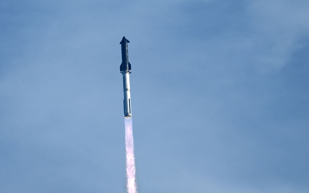 SpaceX's Starship rocket lifts off from Starbase, Texas, as seen from South Padre Island on August 26, 2025, for its tenth test flight. SpaceX's Starship megarocket roared into the skies Tuesday on its 10th test flight, following a string of explosive failures that cast doubt about its ability to realize Elon Musk's vision of colonizing Mars. (Photo by RONALDO SCHEMIDT / AFP)