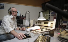 Lloyd in the studio for his final all-night broadcast.