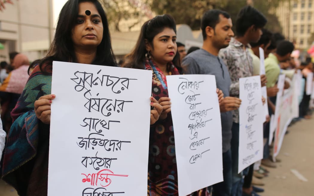 Bangladeshi students and social activists form a human chain in protest of the gang-rape of a mother from Noakhli, in Dhaka, Bangladesh on January 4, 2019.