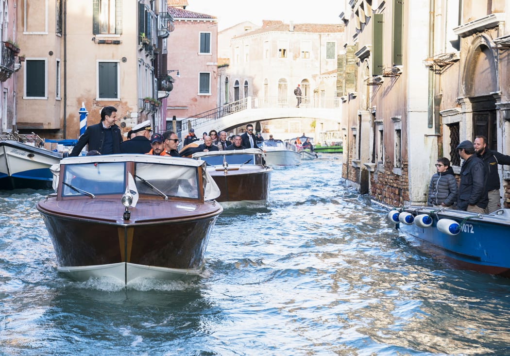 Italy's Prime Minister Giuseppe Conte (left) touring the city's canals on a taxi boat while assessing damages after Venice suffered its highest tide in 50 years.