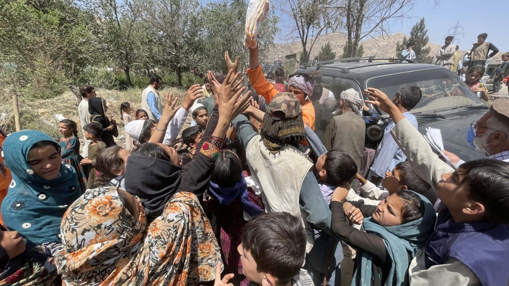 Displaced Afghan families flee northern provinces due to clashes between Taliban and Afghan security as they seek refuge inside a park with harsh conditions in Kabul, Afghanistan, on August 10, 2021.