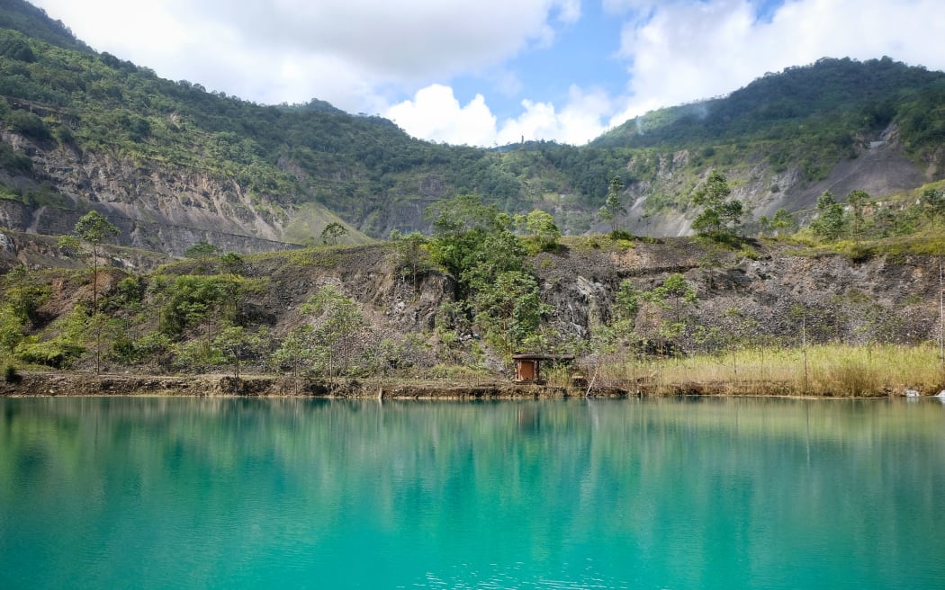 A lake in the pit of the long defunct Panguna mine in Bougainville.