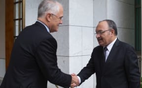 Malcolm Turnbull greats Peter O'Neill.