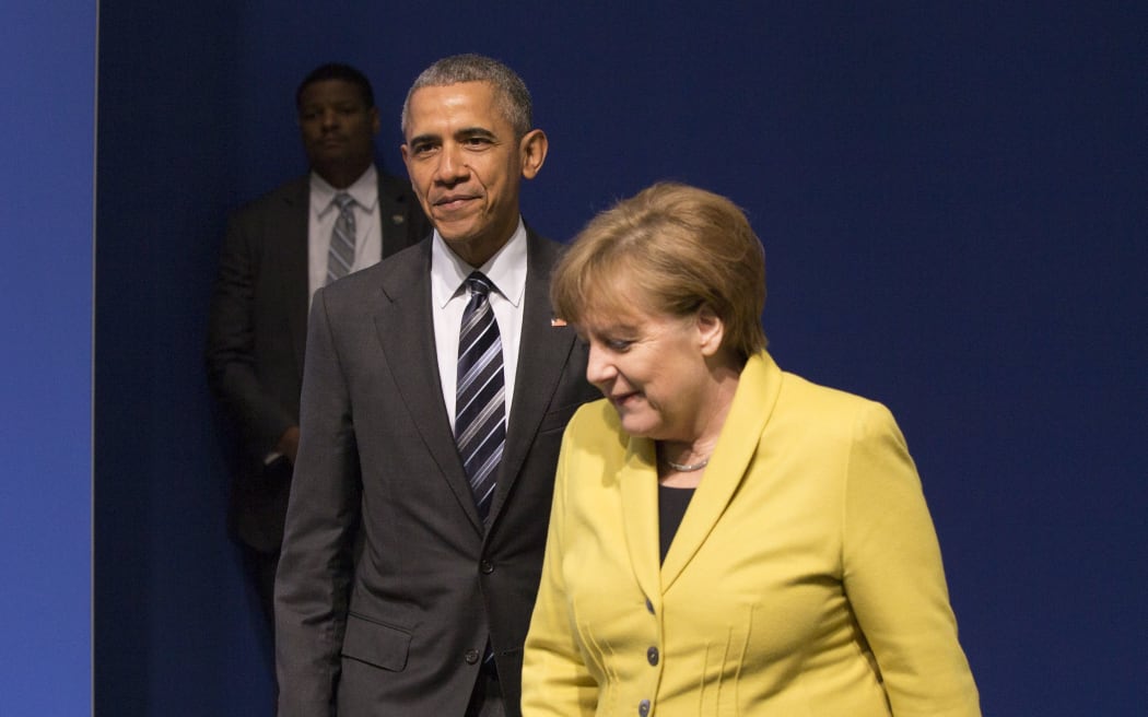 US President Barack Obama and German Chancellor Angela Merkel at a news conference in Hanover.