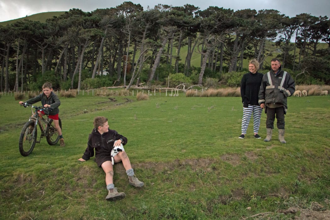 Charlie James, 8 (left), Tom James, 10, and their parents Andrea and Dan James on their new farm at Herbertville, Hawke's Bay
