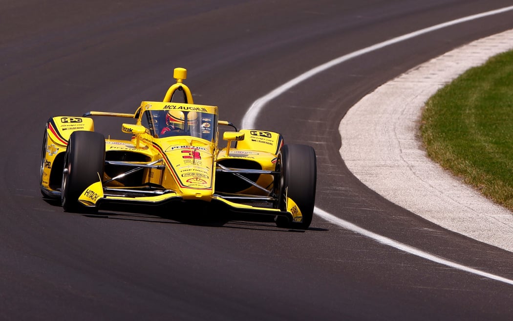 Team Penske's Scott McLaughlin exits turn one during practice for the the Indianapolis 500.