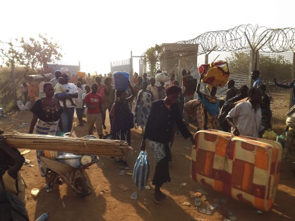 People arrive to seek refuge in a UN  compound in Juba
