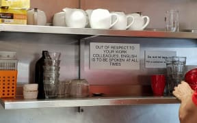 The sign at Circus Circus cafe, which asks staff to speak only English.