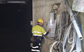 A crewman looks at list outside the 30m concrete seal at Pike River mine.