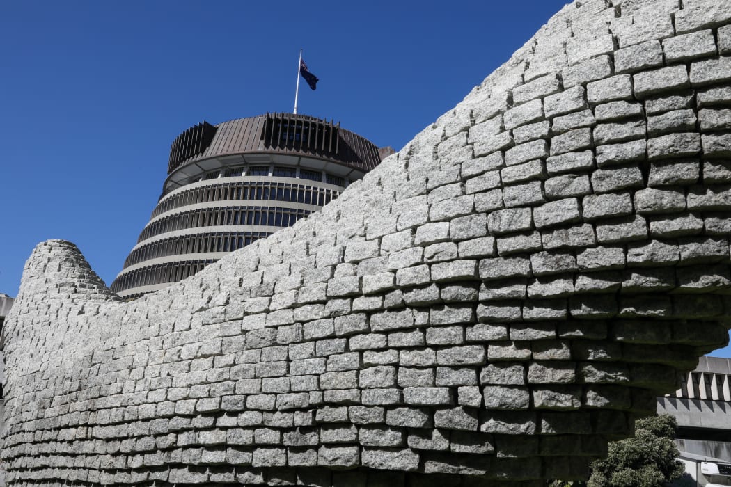The Beehive dwarfed by a sculpture in the park across from it