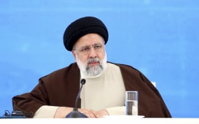 In this photo released by the Iranian Presidency Office, President Ebrahim Raisi attends the inauguration ceremony of dam of Qiz Qalasi, or Castel of Girl in Azeri, at the border of Iran and Azerbaijan with his Azeri counterpart Ilham Aliyev, Sunday, May 19, 2024. A helicopter carrying Iranian President Ebrahim Raisi suffered a "hard landing" on Sunday, Iranian state media reported, without immediately elaborating. (Iranian Presidency Office via AP)