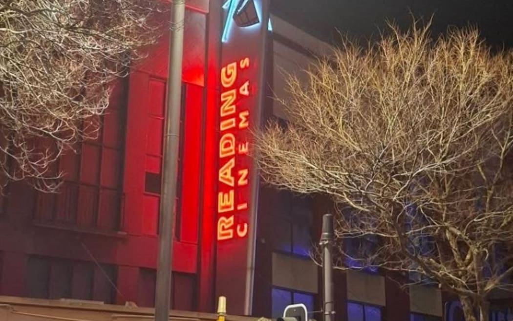 Lit up signs on the derelict Reading Cinemas building in central Wellington has caused speculation on when it might reopen.