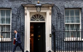 Britain's Prime Minister Rishi Sunak leaves from 10 Downing Street in central London, on January 24, 2024 to take part in the weekly session of Prime Minister's Questions (PMQs) in the House of Commons. (Photo by HENRY NICHOLLS / AFP)
