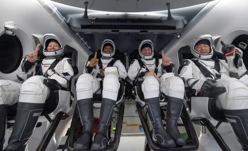 The SpaceX crew, from left, Nasa astronauts Shannon Walker, Victor Glover, Mike Hopkins, and JAXA (Japan Aerospace Exploration Agency) astronaut Soichi Noguchi