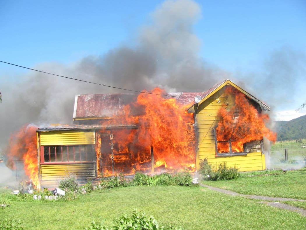 The fire began yesterday afternoon, at Chris' home in Takaka.