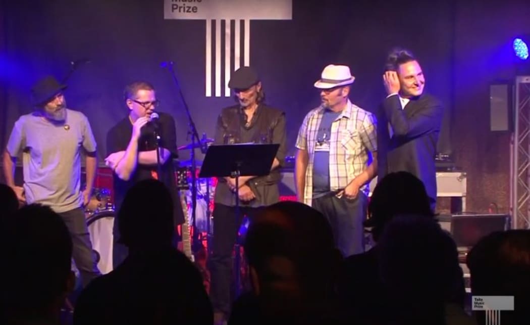 The Headless Chickens go up to accept their award at the Taite Music Awards.