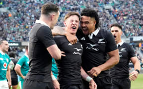 Cam Roigard celebrates scoring against Ireland.