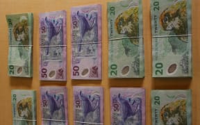 Thousands of dollars in cash was recovered today, in addition to more than $120,000 in cash during previous weeks, said police.