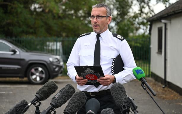 Gloucestershire Constabulary assistant chief constable Richard Ocone speaks to the media near RAF Fairford base in Fairford, south-west England on September 27, 2026, as UK counter-terrorism police investigate an incident near the base in the village of Whelford. British police on September 27 declared a major incident and evacuated villagers living near a base used by the US air force after arresting several men on suspicion of explosives offences. (Photo by JUSTIN TALLIS / AFP)