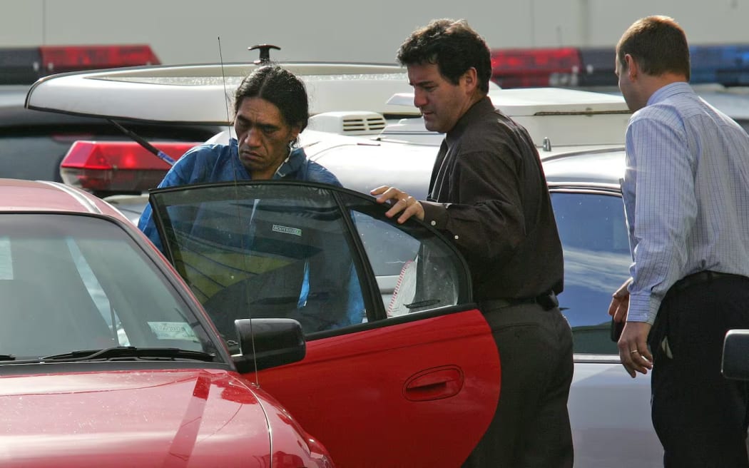 Roger Kahui, left, leaving Papakura police station on his way to appear in the Pukekohe District Court in 2008.