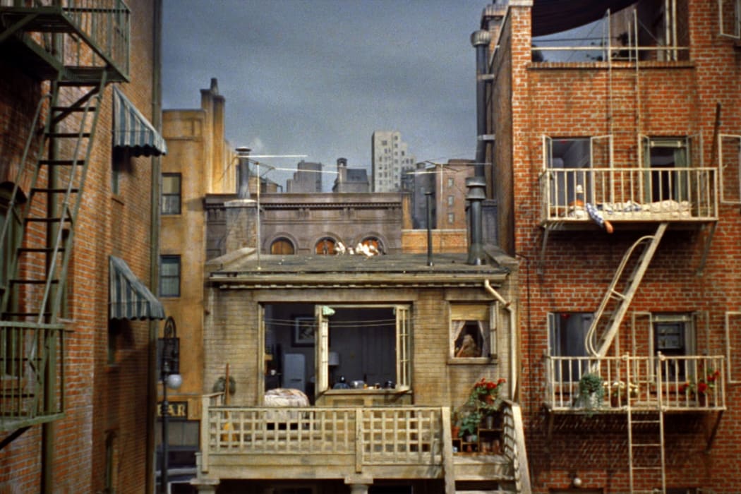 Still from Alfred Hitchcock's 1954 thriller Rear WIndow showing the view from Jimmy Stewart's apartment to the apartment buildings opposite (constructed in the Paramount studio in Hollywood)