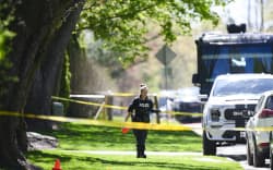 Toronto police patrol outside the home of Canadian rapper Drake after reports of a shooting early on May 7, 2024, according to media reports. The home was cordoned off by police after police reported a pre-dawn shooting near the property.
