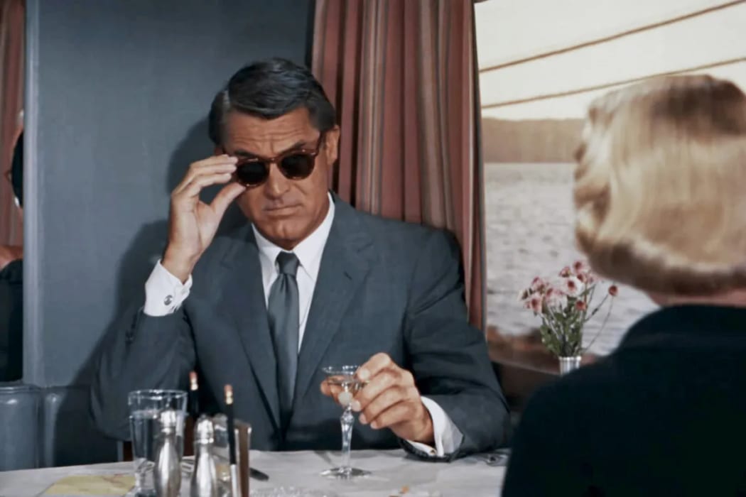 Movie still from Alfred Hitchcock's 1959 film North by Northwest featuring Cary Grant as Roger Thornhill.