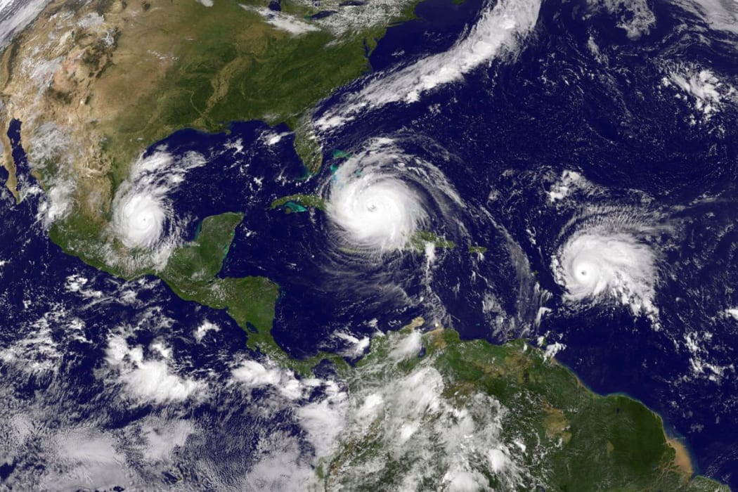 This satellite image shows three storms in the Atlantic: Hurricane Irma, Tropical Storm Jose, and Tropical Storm Katia, on September 8th.