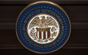 The US Federal Reserve seal. AFP PHOTO/BRENDAN SMIALOWSKI