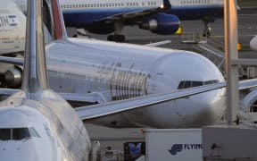 Emirates Airlines flight 201 (middle-R) is seen at New York's John F. Kennedy International Airport on October 29, 2010. The flight which originated in Yemen was reportedly escorted by US fighter jets as it reached US air space because it had a package from Yemen on board.