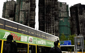 The high-rise apartment building where the fire broke out about one month ago is pictured in Tai Po District, northern Hong Kong, on Decmber 25, 2025. The fire which killed 160 people broke out around 3:00 PM on November 26th in a section of eight public 32 stories high apartment buildings, burning a total of seven buildings. ( The Yomiuri Shimbun ) (Photo by Nobuha Endo / The Yomiuri Shimbun via AFP)