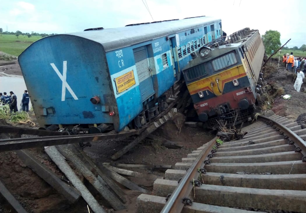 The trains were crossing a partially flooded bridge when they derailed
