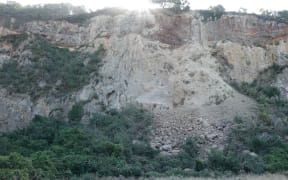 Cliff collapse over the road on Wakefield Ave in Sumner just 100 metres from homes.