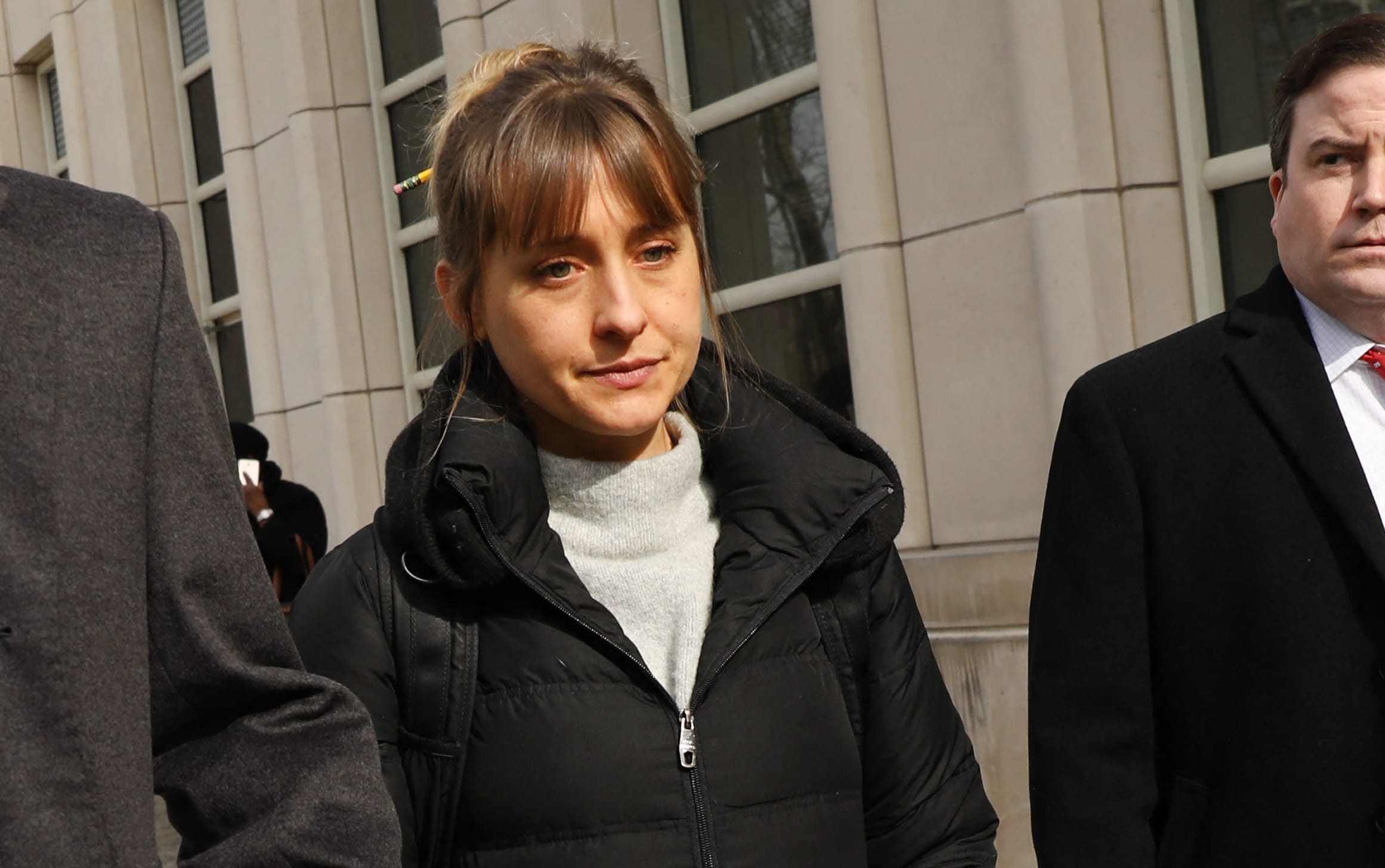 Actress Allison Mack leaves the Brooklyn Federal Courthouse with her lawyers after a court appearance surrounding NXIVM on 6 February, 2019 in New York City.