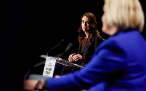 Labour leader Jacinda Ardern looks on as National leader Judith Collins speaks at The Press debate in Christchurch.  06/10/20