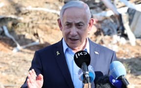 Israel's Prime Minister Benjamin Netanyahu gives a statement during a visit to the site of the Weizmann Institute of Science, which was hit by an Iranian missile barrage, in the central city of Rehovot on June 20, 2025. (Photo by Jack GUEZ / POOL / AFP)
