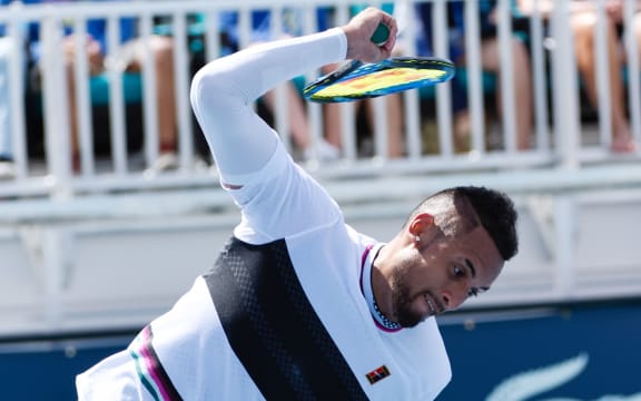 Australian tennis player Nick Kyrgios throws his racquet.