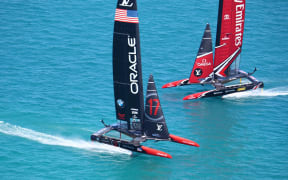 Team New Zealand and Oracle during racing on the second day of the America's cup final racing.