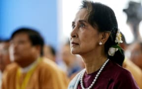 (FILES) In this file photo taken on July 17, 2019, Myanmar's State Counsellor Aung San Suu Kyi attends the opening ceremony of the Yangon Innovation Centre in Yangon.