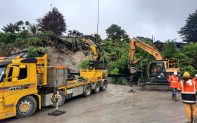 Contractors clean up a slip on Hill Rd in Gisborne.