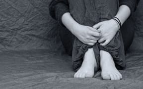 Person sitting on floor