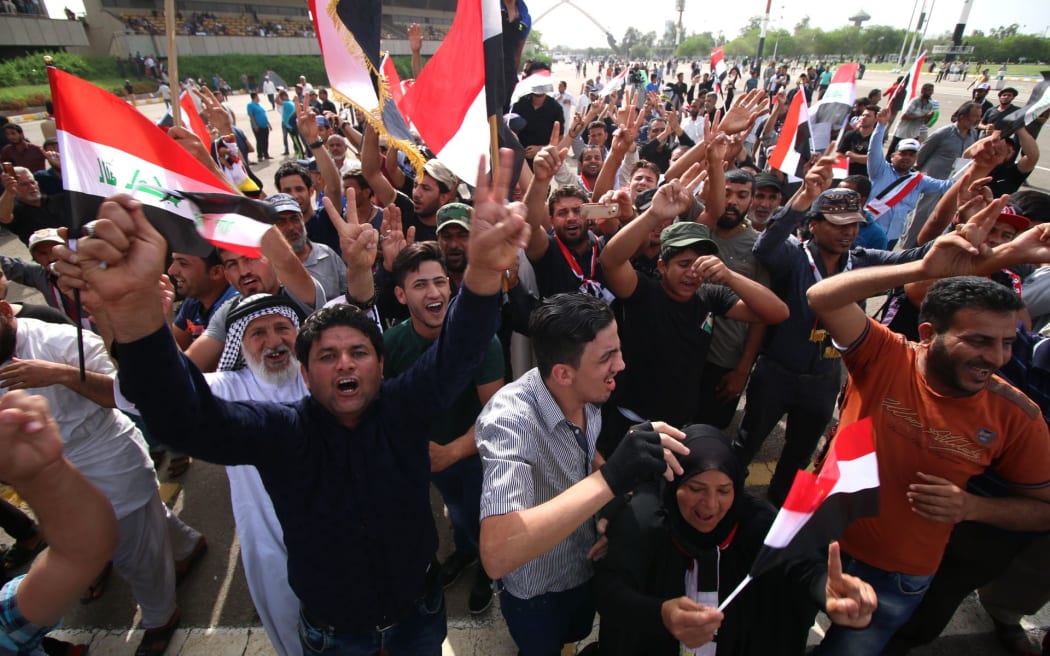 Iraqi protesters in the parade grounds outside the parliament in Baghdad's heavily fortified Green Zone.