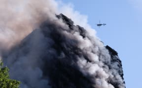 Flames and smoke engulf Grenfell Tower, a residential block of flats in west London on June 14, 2017. The fire caused 71 deaths.