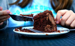 Chocolate cake being eaten