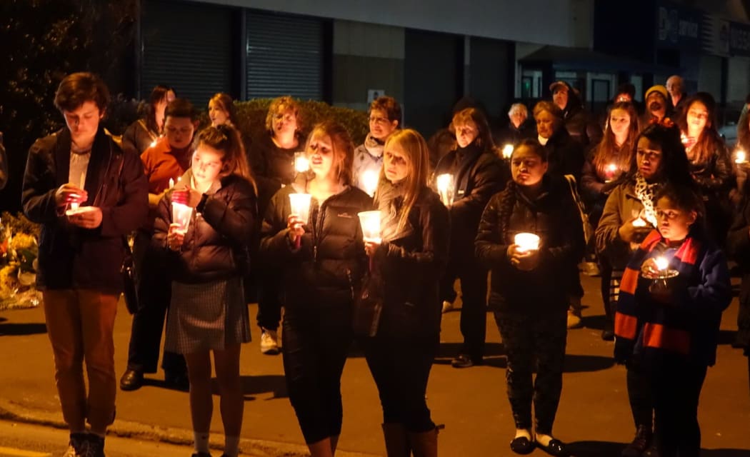 A candle-lit vigil for the victims of Monday's shootings.